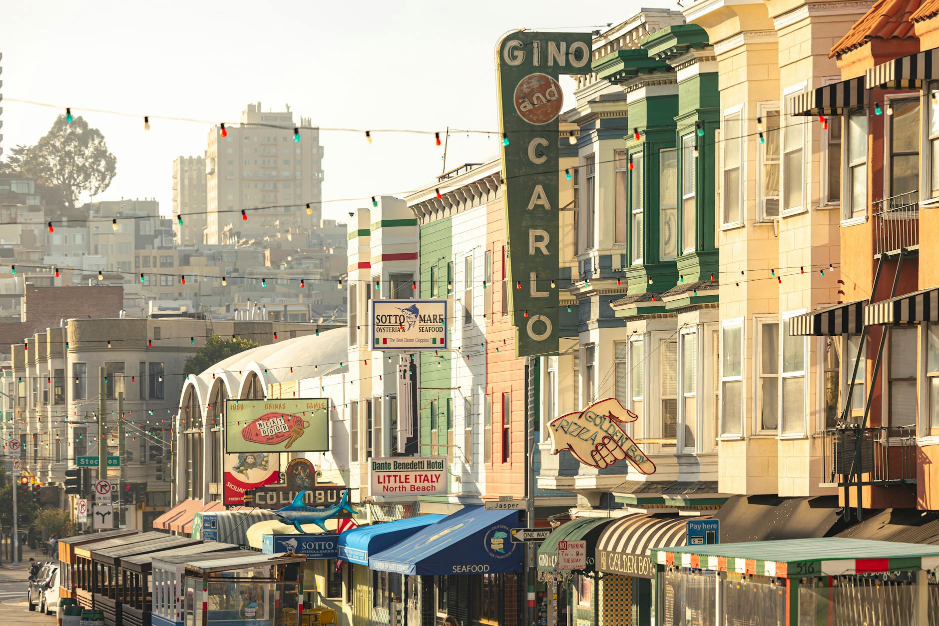 Colorful street view of North Beach, San Francisco with lively shops and iconic architecture.