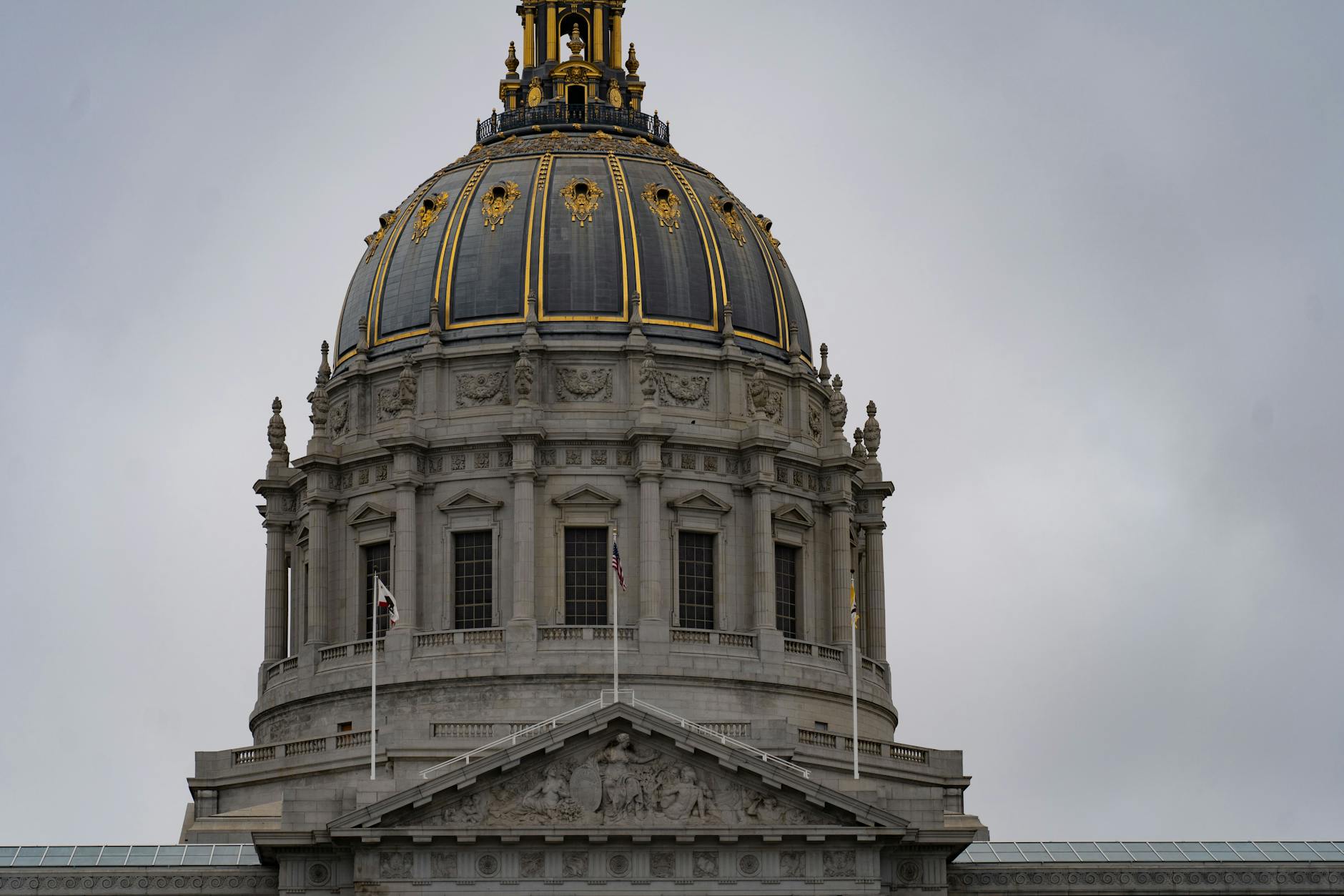 Closeup of San Francisco City Hall's dome showcasing neoclassical architecture.